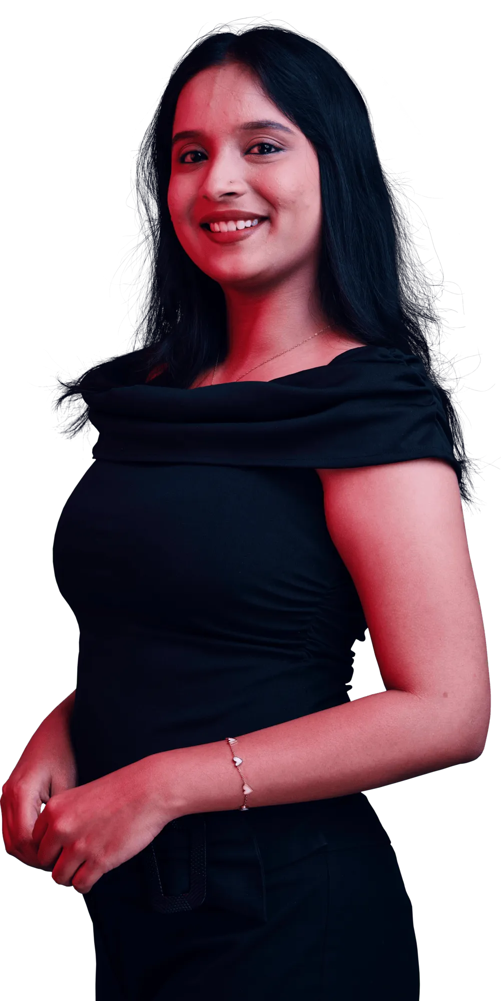 Smiling woman with long dark hair wearing a black dress stands against a dark background.