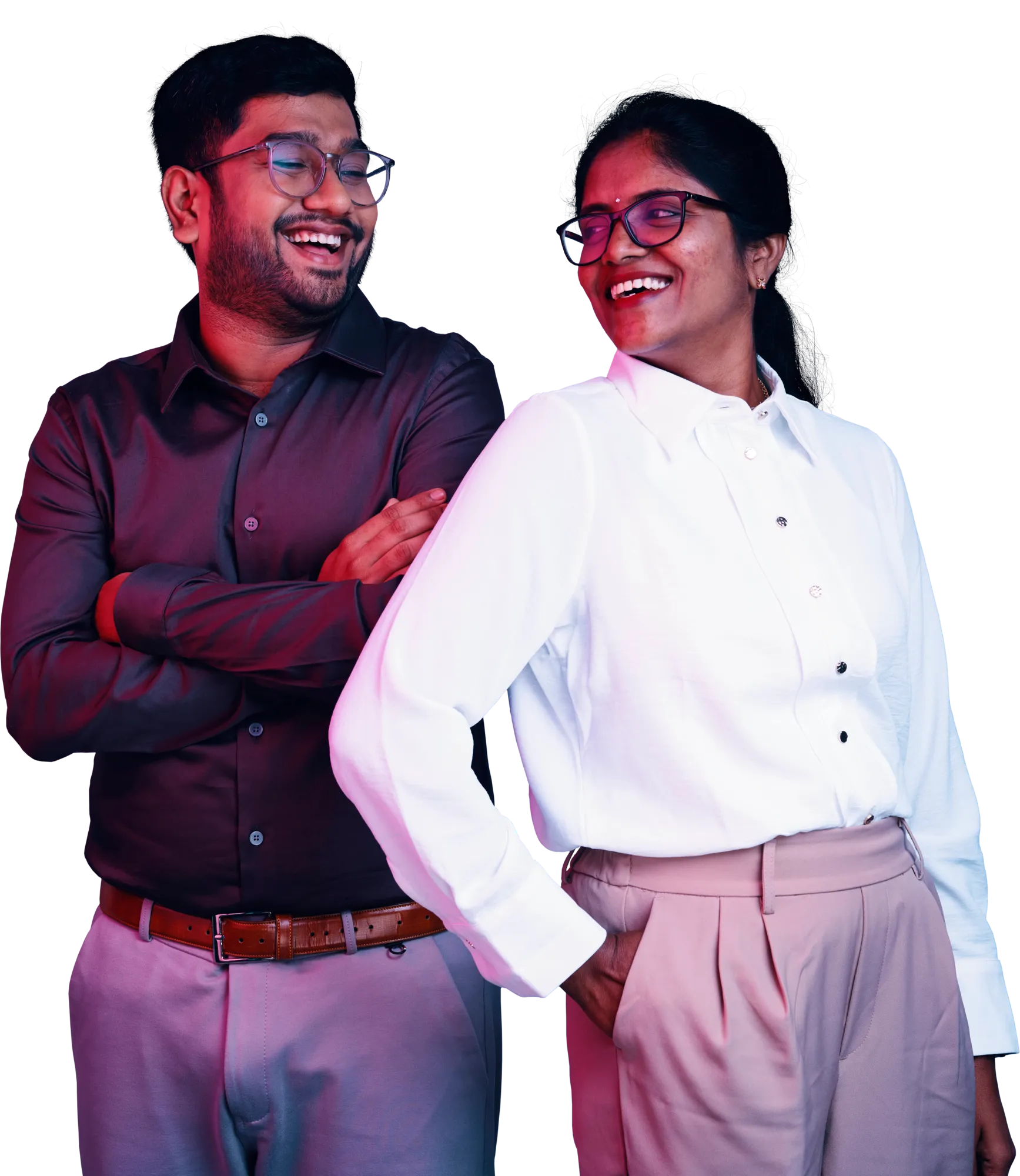 A man and a woman in business attire smiling at each other.